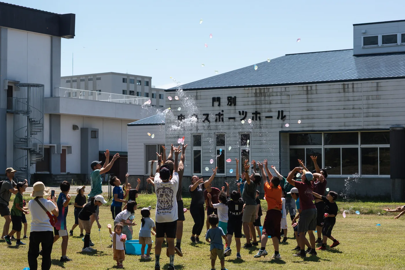 Families and children sharing an outdoor activity in Japan